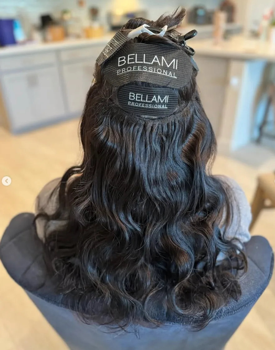 Dark brunette Bellami hair extensions installed in neat, concealed rows